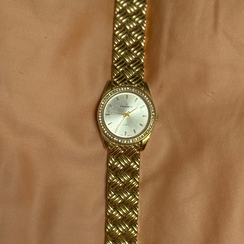 Peugeot Gold Watch with Silver Face